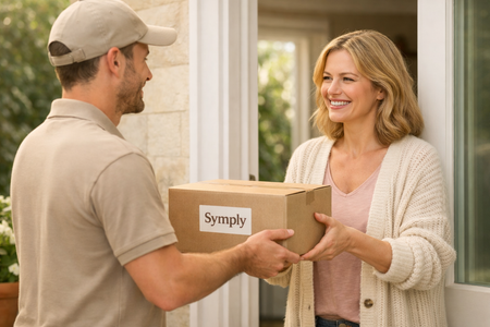 Man delivering a package labeled 'Symply' to a woman at a door.