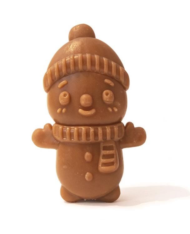 Chocolate gingerbread man figurine with a hat and scarf on a white background