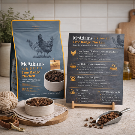 McAdams Air Dried Free Range Chicken dog food packaging with a bowl of food and scoop on a table.
