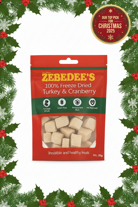 Zebedee's freeze-dried turkey and cranberry treats packaging with Christmas decorations.